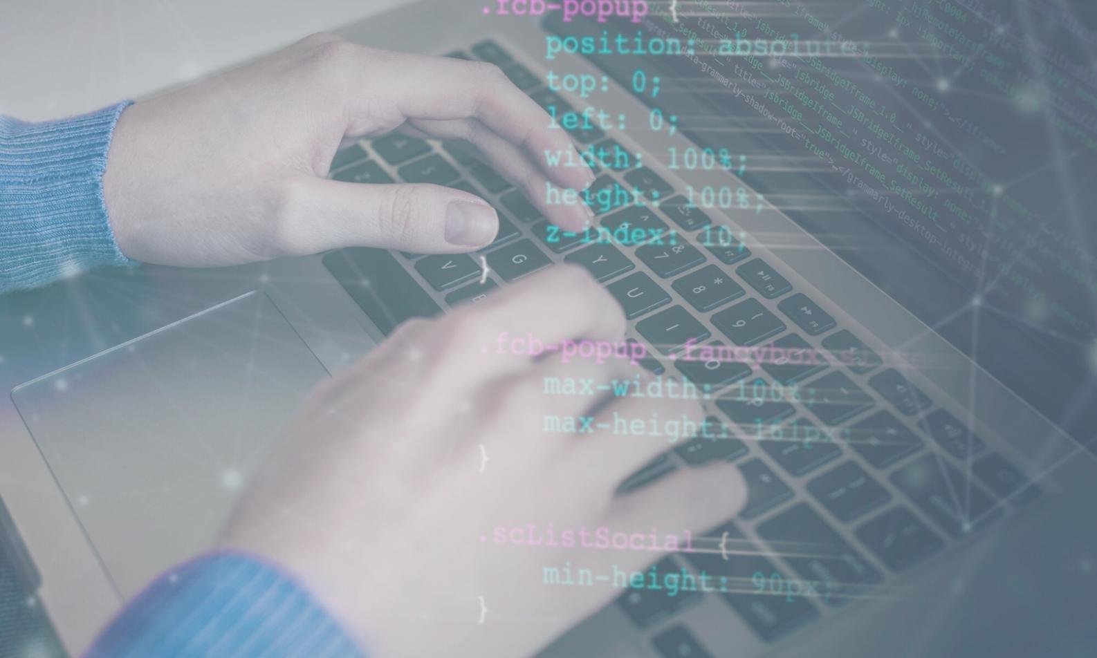 Workshop participants collaborating on mobile game development projects